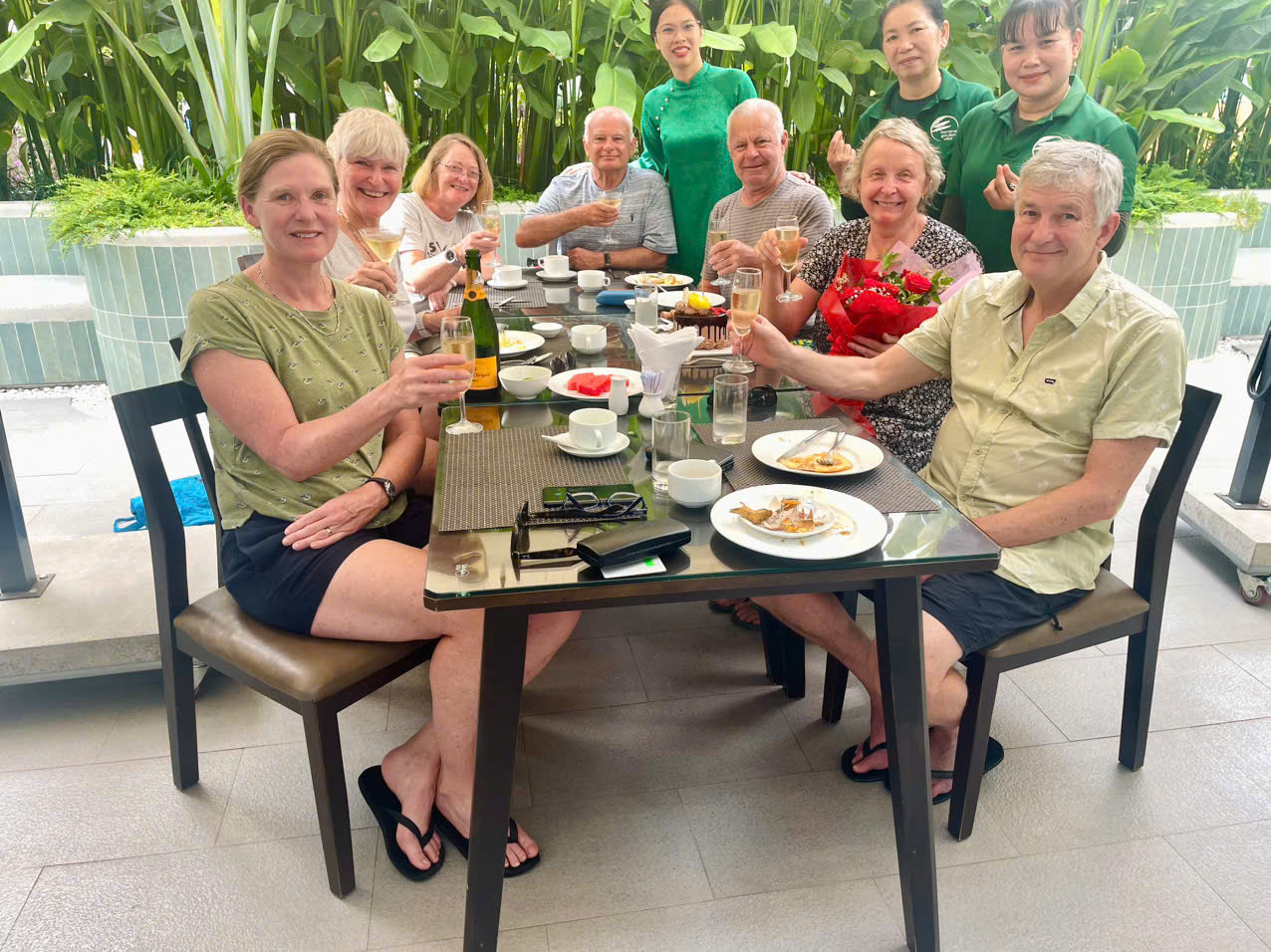 Guests toasting with champagne on the restaurant terrace