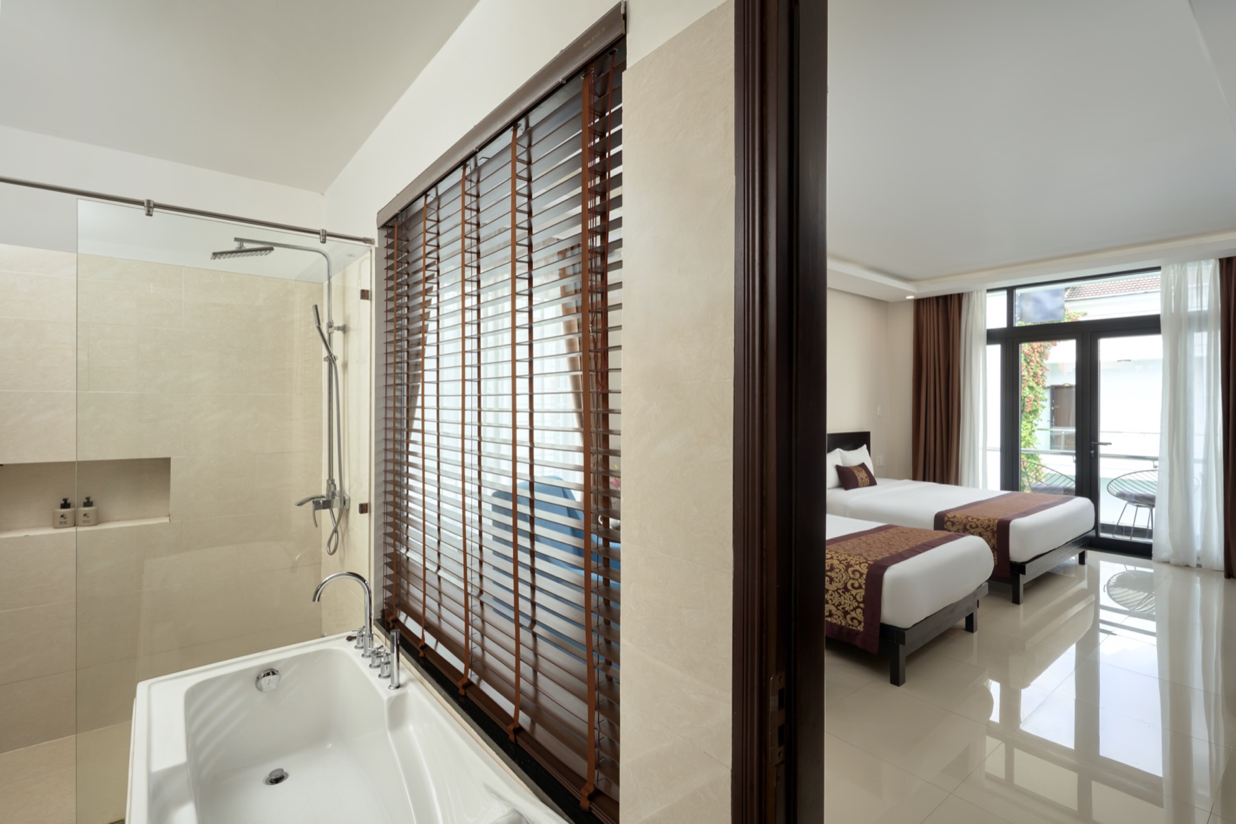 Premier Double/Twin room with an ensuite bathtub and city-facing balcony